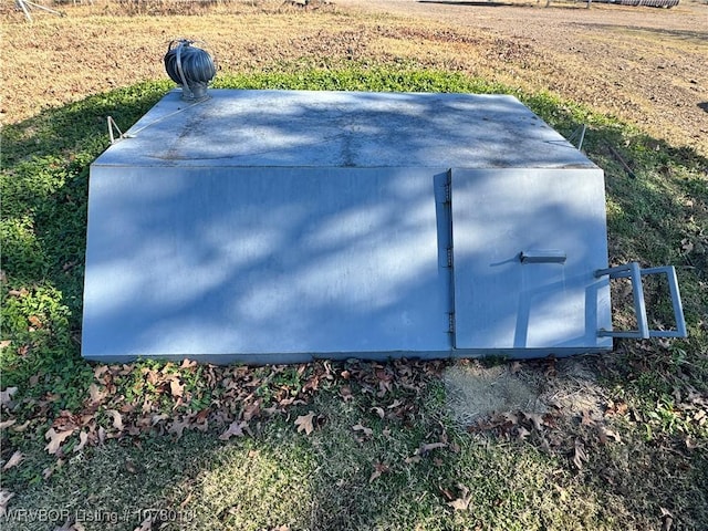 view of entry to storm shelter