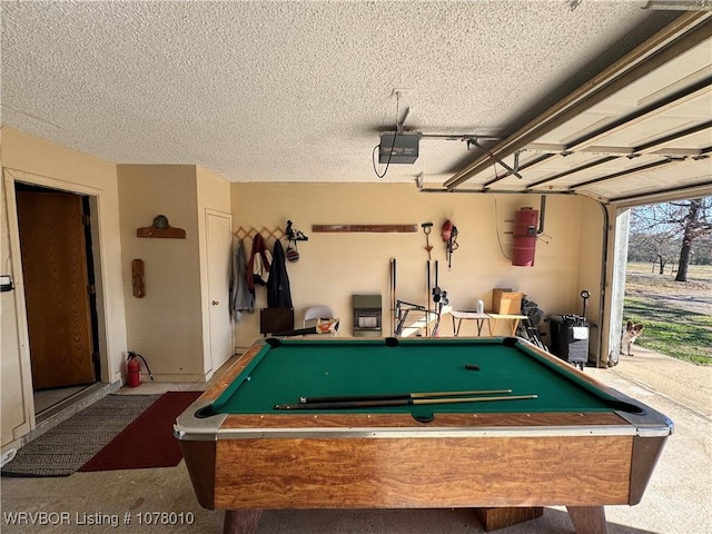 rec room with a textured ceiling and billiards