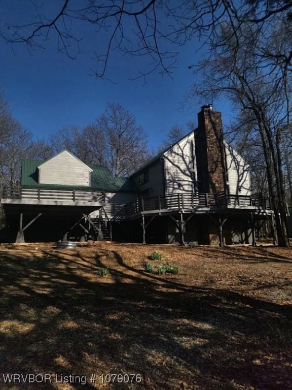 view of side of home with a chimney