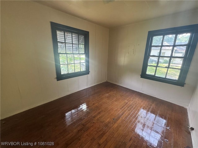 1025 Henry St, Alma, AR 72921 - spare room with plenty of natural light, hardwood / wood-style flooring, and baseboards