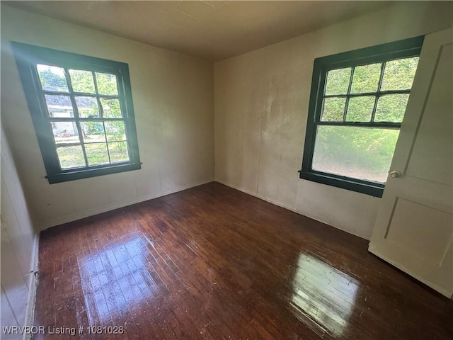 1025 Henry St, Alma, AR 72921 - spare room featuring hardwood / wood-style flooring and baseboards
