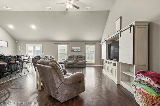 living room with lofted ceiling, ceiling fan, and dark hardwood / wood-style floors