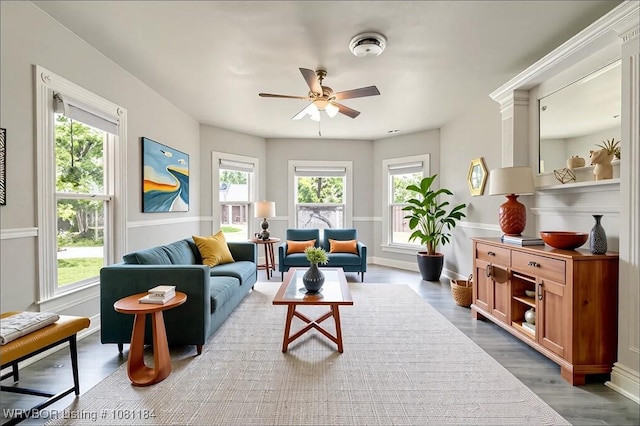 408 Denver St, Greenwood, AR 72936 - living area with healthy amount of natural light, a ceiling fan, wood finished floors, and baseboards