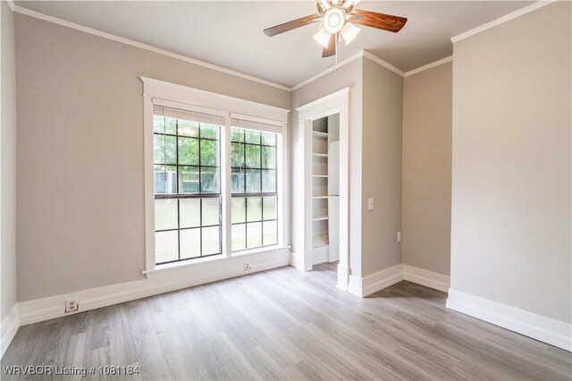 408 Denver St, Greenwood, AR 72936 - unfurnished room featuring baseboards, crown molding, ceiling fan, and wood finished floors