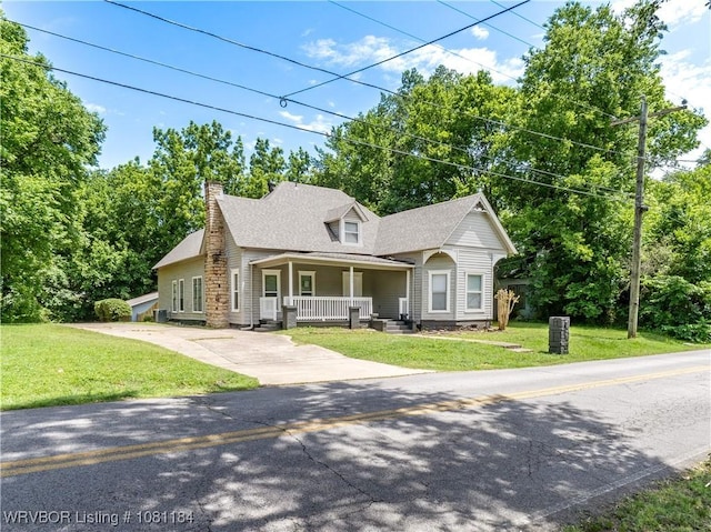 408 Denver St, Greenwood, AR 72936 - view of front facade with covered porch, a front lawn, a chimney, concrete driveway, and roof with shingles