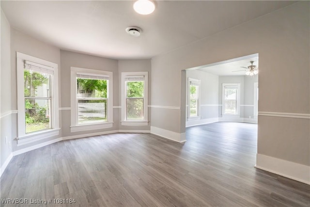 408 Denver St, Greenwood, AR 72936 - spare room with wood finished floors, baseboards, and a ceiling fan