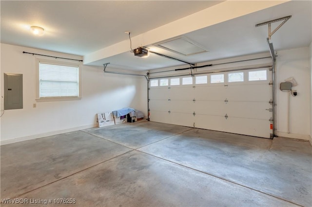 garage featuring a garage door opener and electric panel