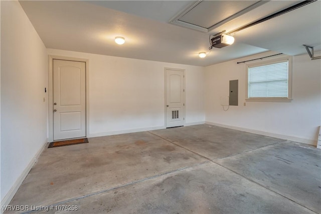 garage featuring a garage door opener and electric panel