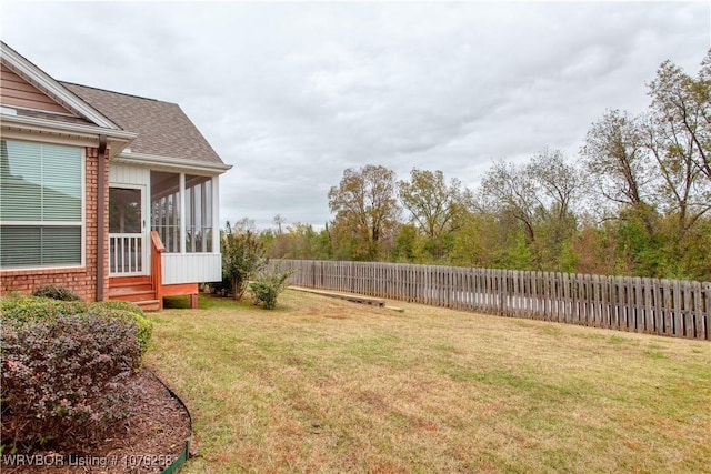 view of yard with a sunroom