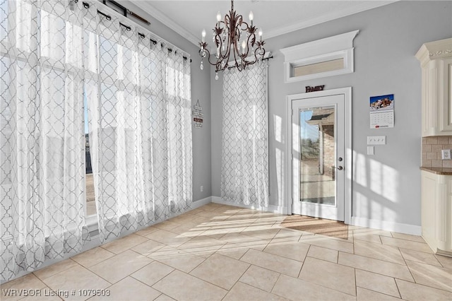 unfurnished dining area with a chandelier, light tile patterned floors, crown molding, and baseboards