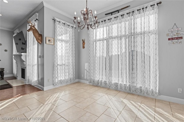 unfurnished dining area featuring tile patterned floors, a notable chandelier, a fireplace, and crown molding