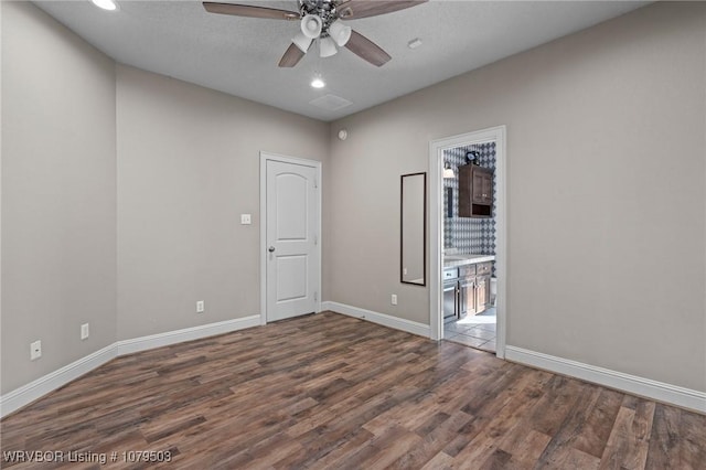 unfurnished bedroom with recessed lighting, baseboards, and wood finished floors