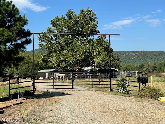 view of road featuring a mountain view and a rural view