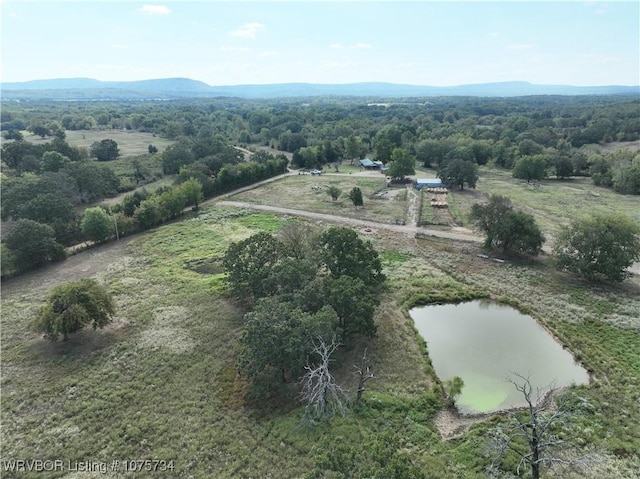 aerial view with a rural view and a water and mountain view