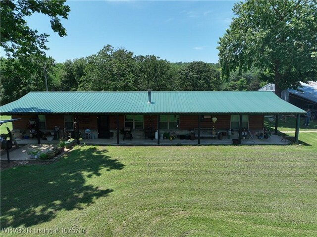 29477 360th Ave, Mccurtain, OK 74944 - view of front of property featuring covered porch, a front yard, and metal roof