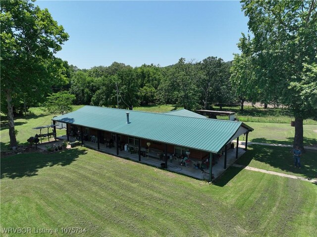 29477 360th Ave, Mccurtain, OK 74944 - back of house with a lawn and metal roof