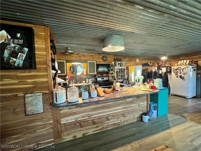 bar with wood walls, white fridge, dark hardwood / wood-style flooring, and wood ceiling