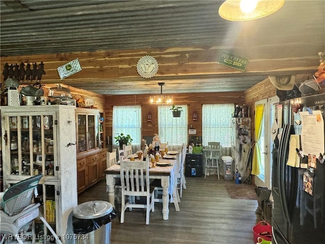 dining room featuring wood walls