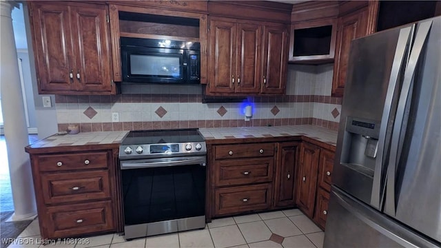 3701 S Cook Rd, Charleston, AR 72933 - kitchen with stainless steel appliances, tile counters, backsplash, and light tile patterned flooring