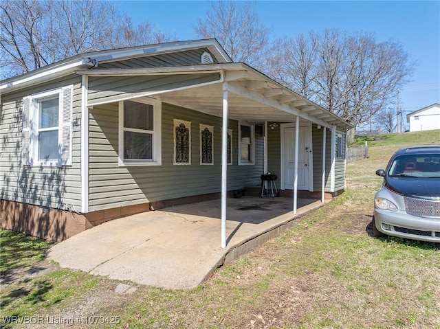 rear view of house with a carport