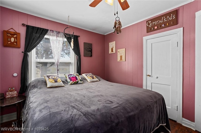 bedroom with ceiling fan and ornamental molding