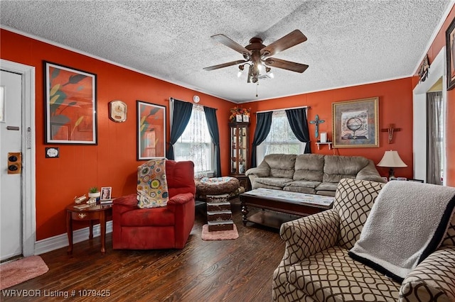 living area with a textured ceiling, wood finished floors, baseboards, and ceiling fan