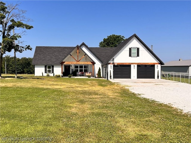 modern inspired farmhouse featuring a front yard, a garage, fence, and gravel driveway