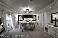 carpeted bedroom with baseboards
