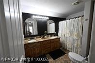 full bath with vanity and toilet