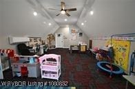 game room with ceiling fan and lofted ceiling