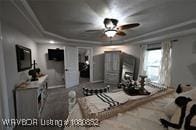 bedroom featuring a tray ceiling and crown molding