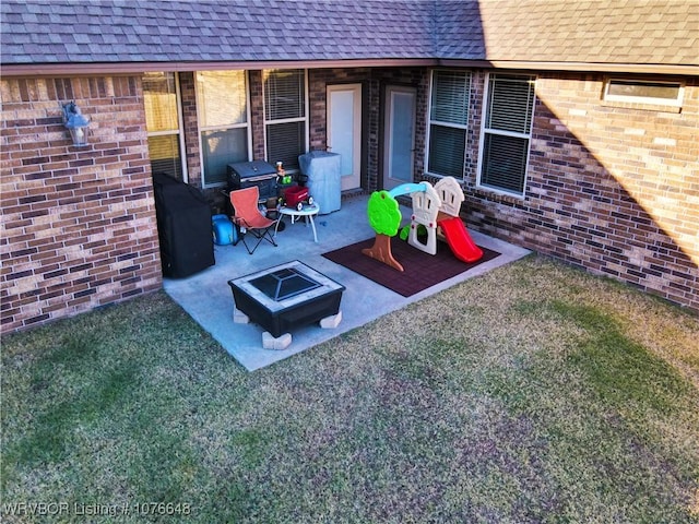 view of patio / terrace featuring grilling area and a fire pit