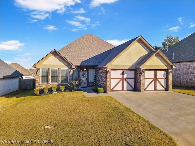 view of front of house with a garage and a front lawn