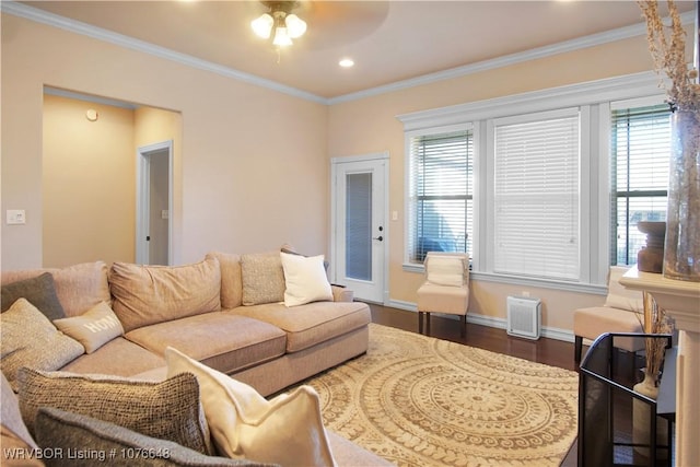 living room featuring dark hardwood / wood-style flooring, ceiling fan, and ornamental molding