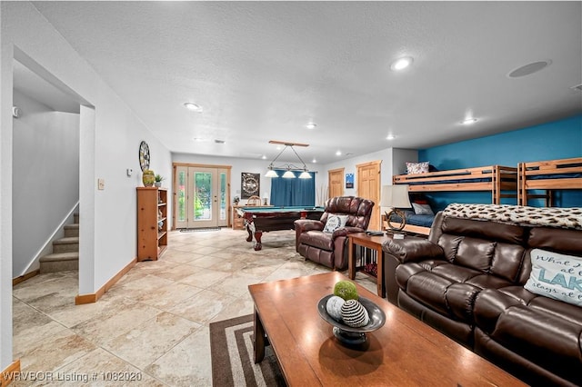 95147 S 4507th Rd, Vian, OK 74962 - living room with billiards table, stairway, recessed lighting, and a textured ceiling