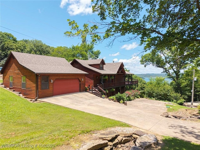 95147 S 4507th Rd, Vian, OK 74962 - view of front of house with log veneer siding, a garage, driveway, a front yard, and a shingled roof