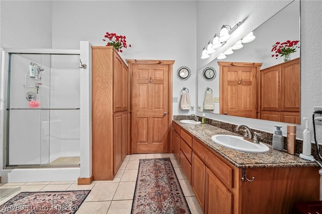 95147 S 4507th Rd, Vian, OK 74962 - bathroom with double vanity, a shower stall, and tile patterned floors