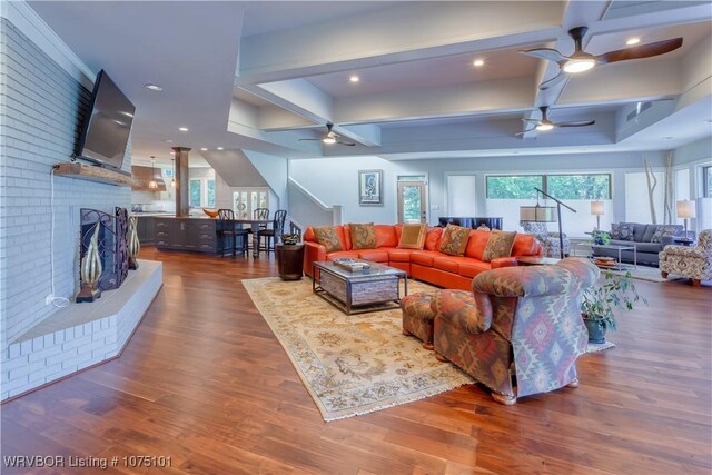 4001 Spring Mountain Rd, Fort Smith, AR 72916 - living room with dark hardwood / wood-style flooring, coffered ceiling, and a brick fireplace