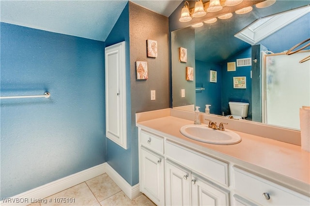 4001 Spring Mountain Rd, Fort Smith, AR 72916 - bathroom featuring a textured ceiling, vanity, lofted ceiling with skylight, tile patterned flooring, and toilet