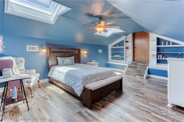 4001 Spring Mountain Rd, Fort Smith, AR 72916 - bedroom with hardwood / wood-style floors, ceiling fan, and lofted ceiling with skylight