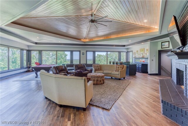 4001 Spring Mountain Rd, Fort Smith, AR 72916 - living room with a healthy amount of sunlight, a brick fireplace, billiards, a tray ceiling, and wood ceiling