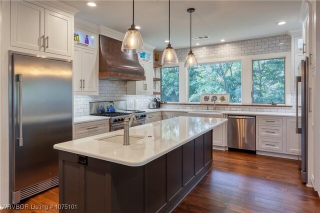 4001 Spring Mountain Rd, Fort Smith, AR 72916 - kitchen with white cabinetry, a kitchen island with sink, premium range hood, backsplash, and high quality appliances