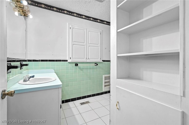 19 Hiland Dr, Fort Smith, AR 72901 - bathroom featuring vanity, tile patterned floors, tile walls, and a wainscoted wall