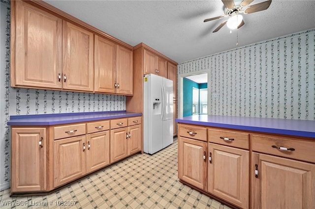 19 Hiland Dr, Fort Smith, AR 72901 - kitchen featuring white fridge with ice dispenser, wallpapered walls, a ceiling fan, light floors, and a textured ceiling