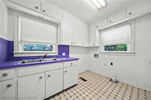 19 Hiland Dr, Fort Smith, AR 72901 - washroom with cabinet space, healthy amount of natural light, light flooring, and hookup for an electric dryer