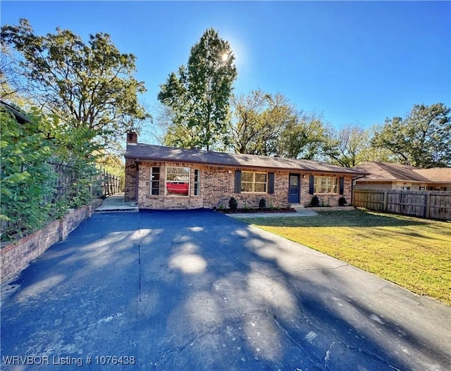 ranch-style house with a front yard