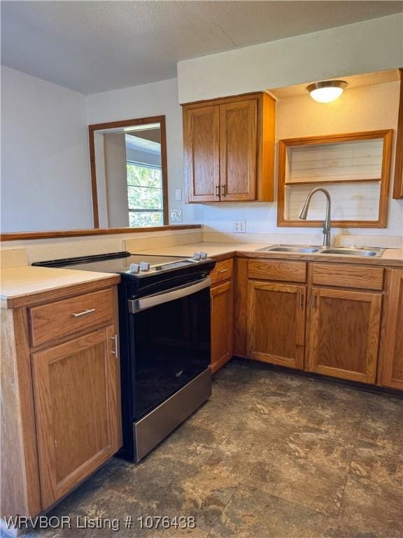 kitchen with range with electric stovetop and sink