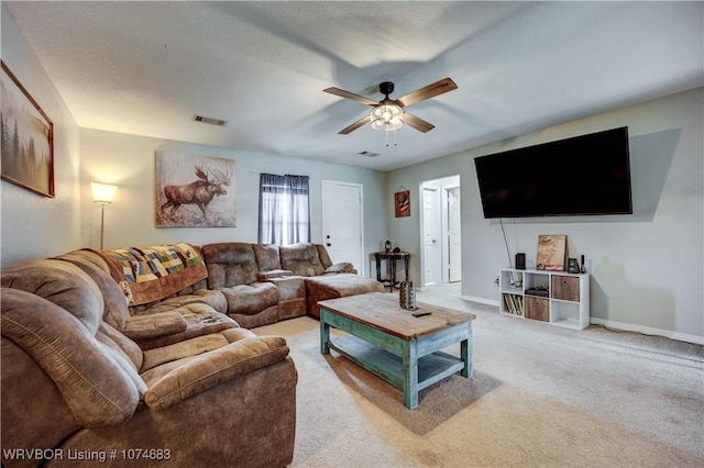 living room with carpet and ceiling fan