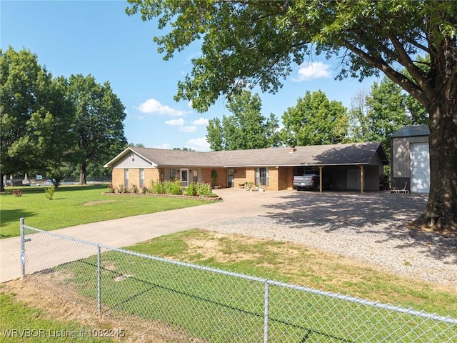 309 Neal Dr, Roland, OK 74954 - ranch-style house with gravel driveway, brick siding, and a carport