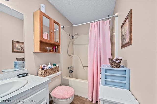 309 Neal Dr, Roland, OK 74954 - full bath featuring shower / bath combo, a textured ceiling, vanity, and wood finished floors